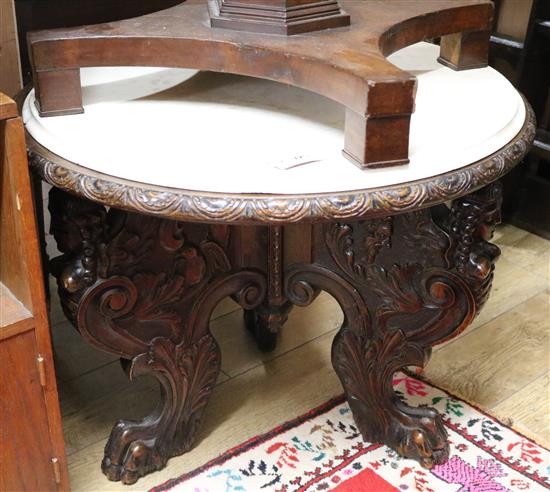 A late Victorian carved walnut occasional table, with simulated marble top W.80cm